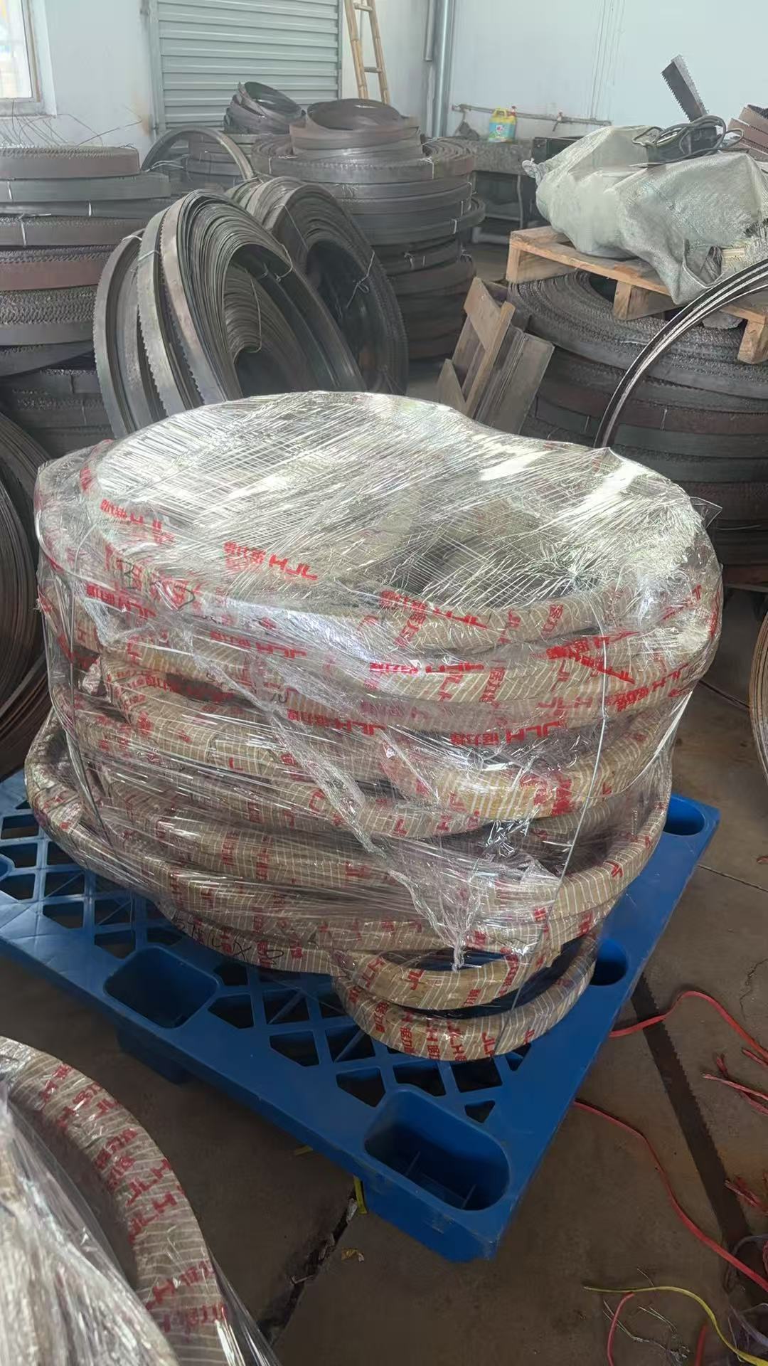 Bandsaw blade coils wrapped and palletized for export