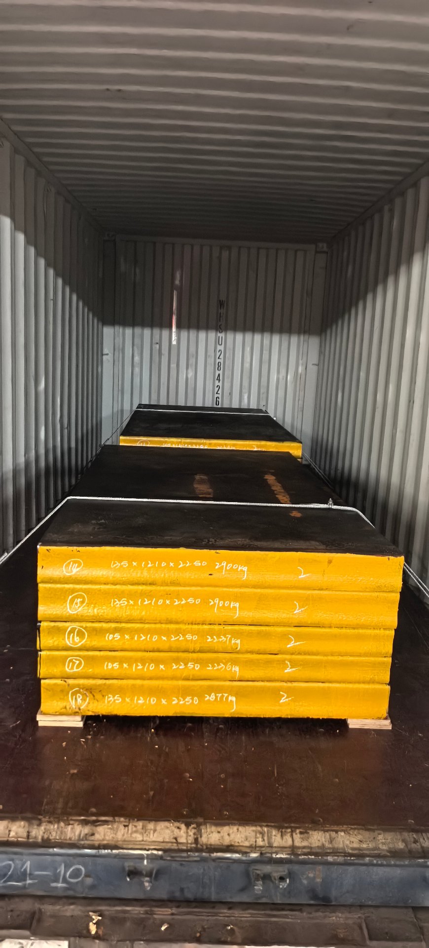 Container loaded with painted steel plates
