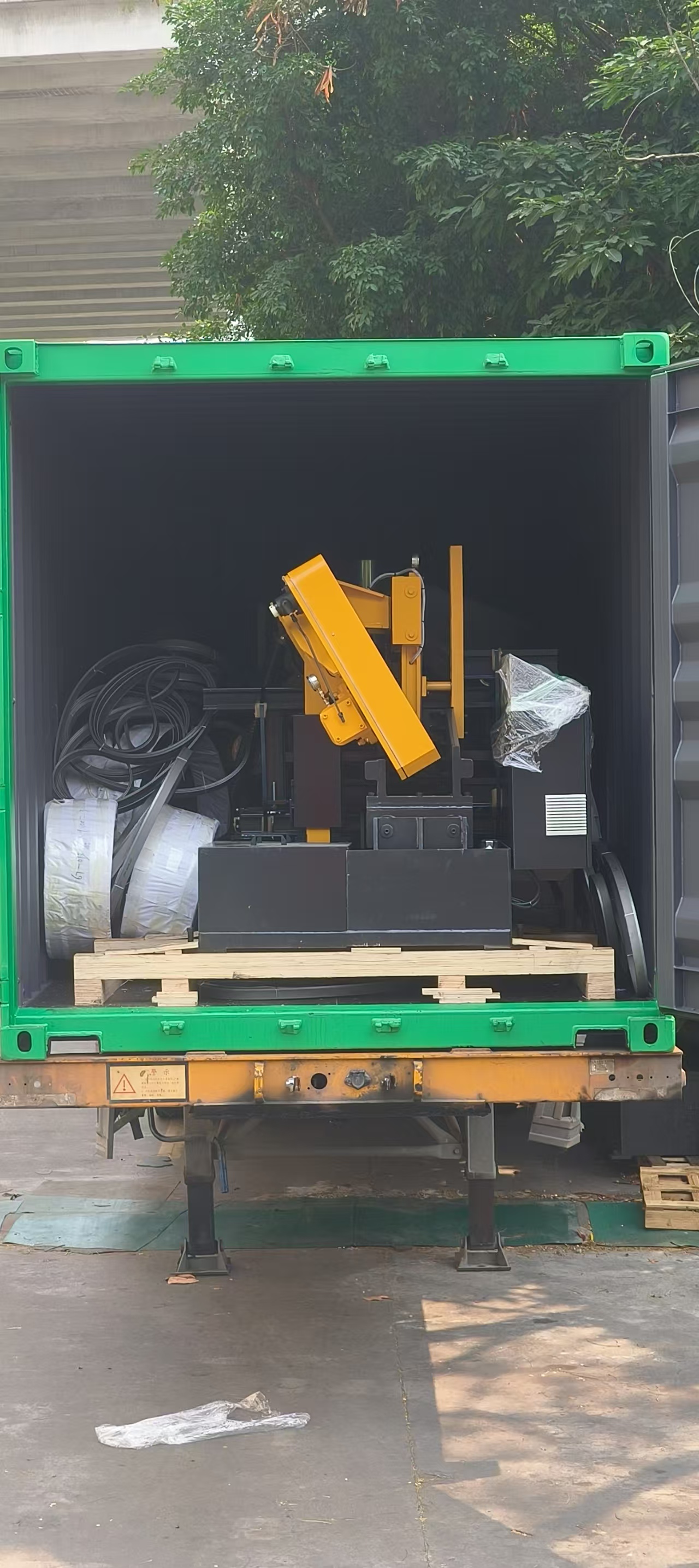 Band saw machine and blades loaded in shipping container