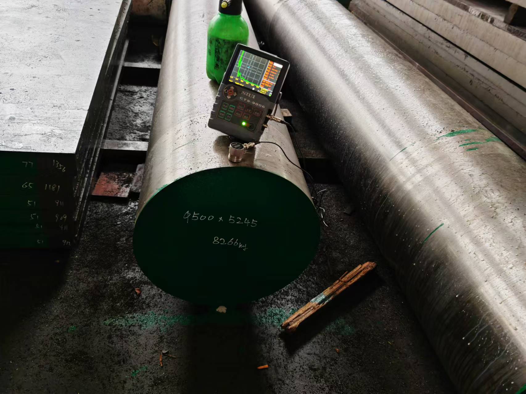Ultrasonic flaw detector (UT) testing a large forged bar